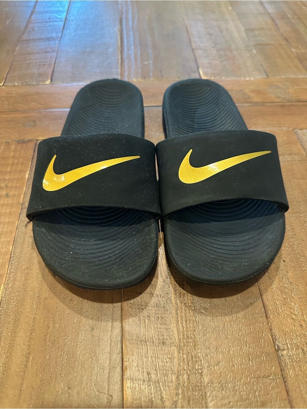 Nike Kids Black Slides with Yellow Swoosh